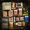 a group of packages on a camouflage surface